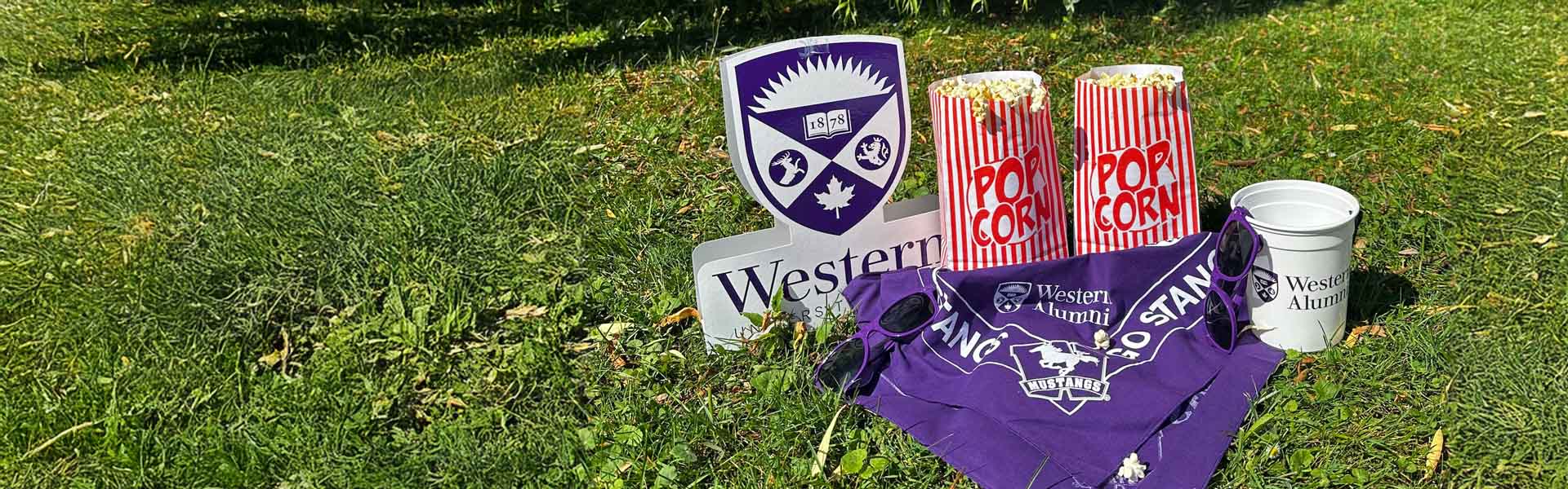 Popcorn and Western merch on grass