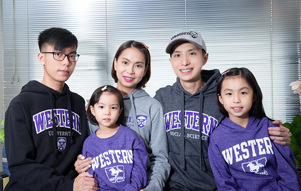 Kant Chong, BA’03, and his wife Virginia (center) with their children: (left to right) Kevin, Nadia and Annabelle.