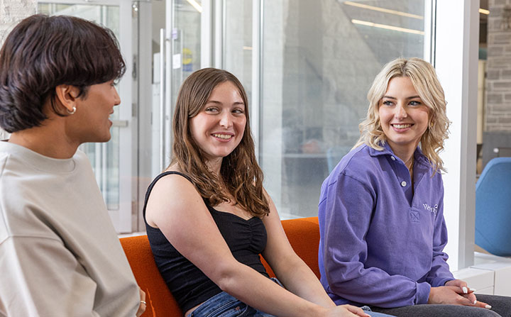 Three students talking