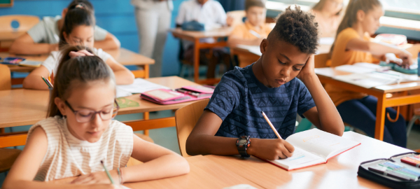 A photo of young children working in class.