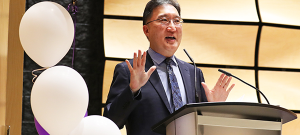 Dean Michael Kim at the podium in von Kuster Hall