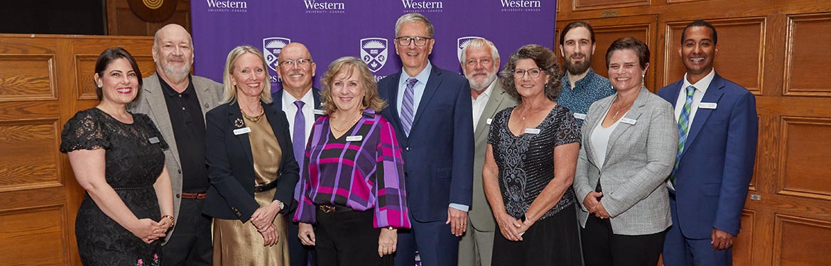 The award recipients pose with President Alan Shepard