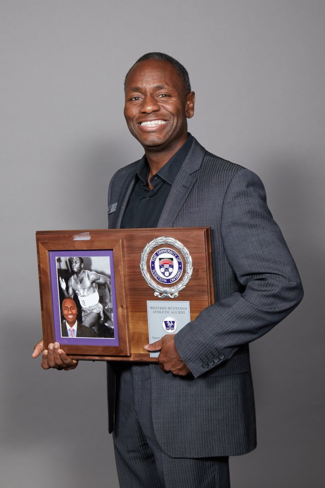 Adrian Jordan holding his WMAA Hall of Fame Inductee plaque