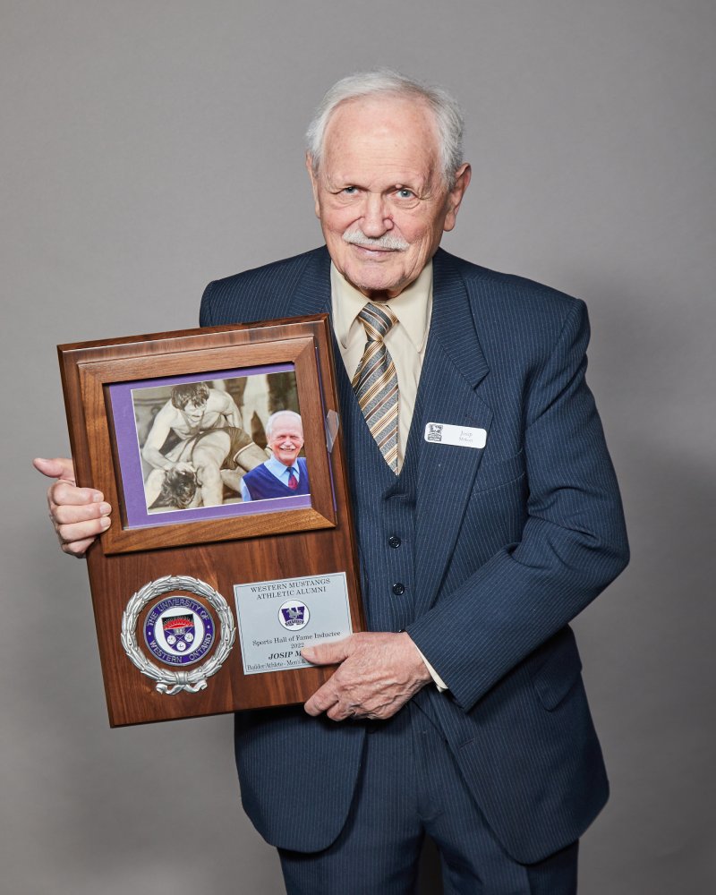 Josip Mrkoci holding his WMAA Hall of Fame Inductee plaque