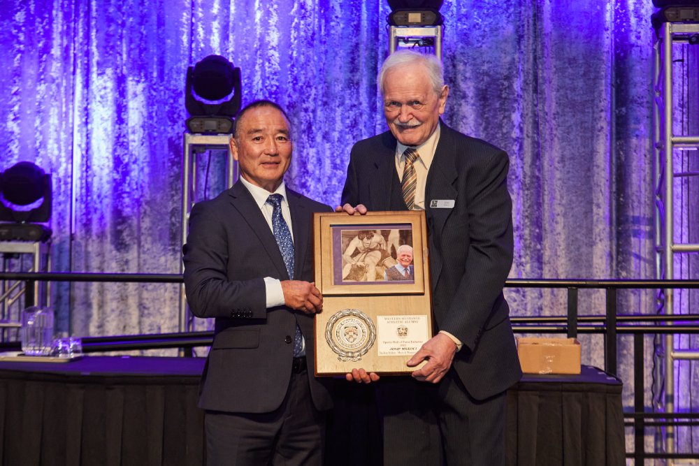 Josip Mrkoci receiving his WMAA Hall of Fame Inductee plaque from Ray Takahashi