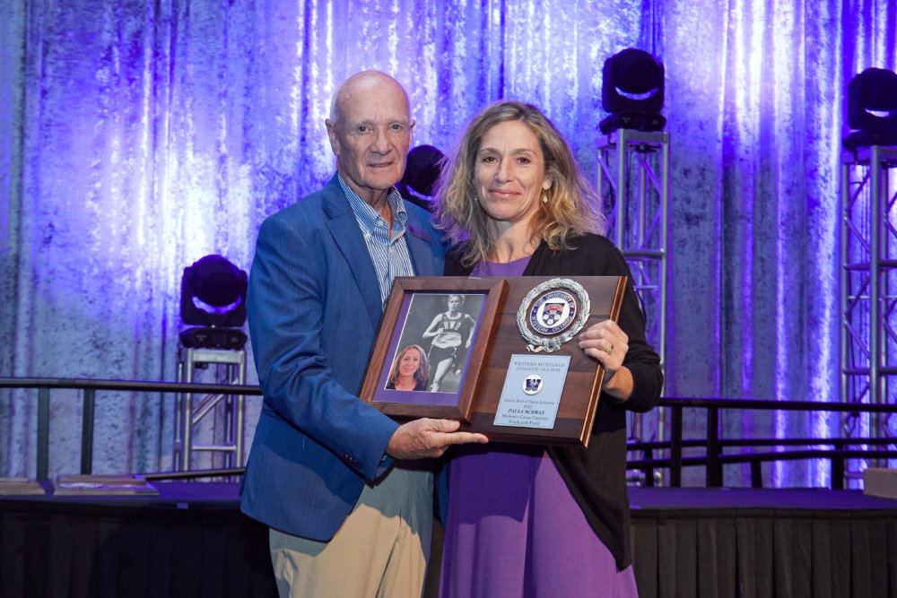 Paula Schwan receiving her WMAA Hall of Fame Inductee plaque from Bob Vigars