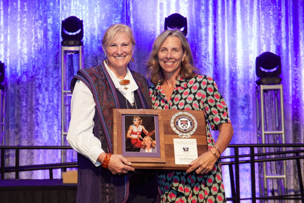 Wendy Wiebe receiving her WMAA Hall of Fame Inductee plaque from Angela Schneider
