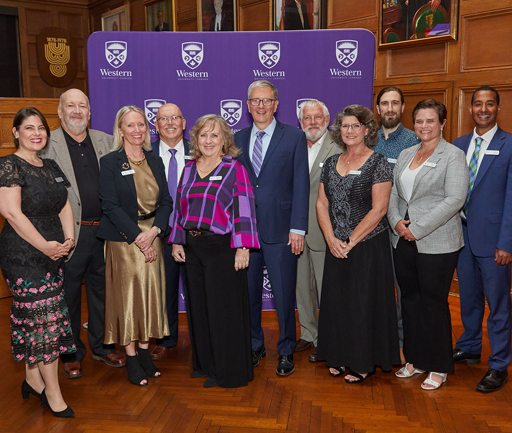 The award recipients pose with President Alan Shepard