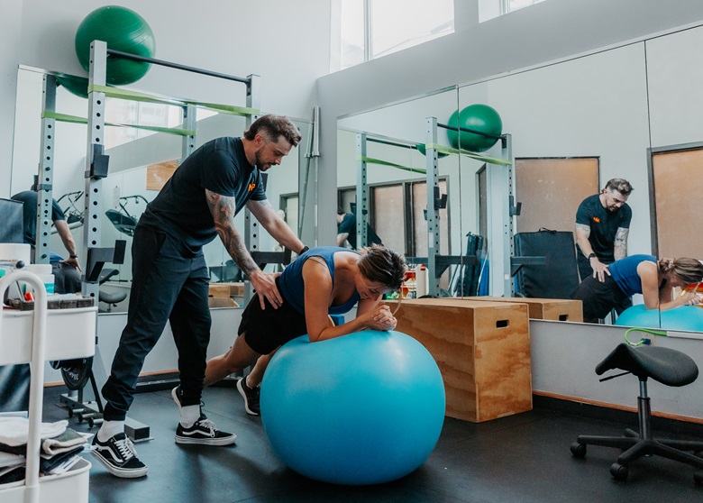 Western physiotherapy grad Blair Hennessey providing patient care.