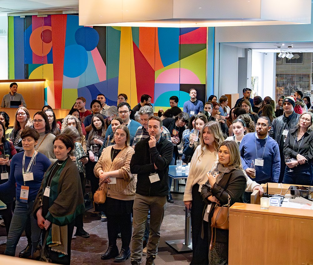 Group Of People Listening To Speaker
